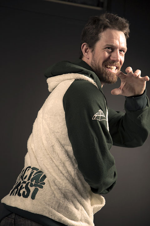 A model wearing a green and white FurGlory hood